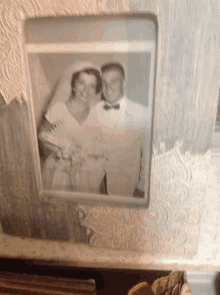 a black and white picture of a bride and groom