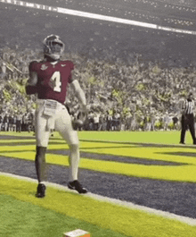 a football player wearing a jersey with the number 4 on it