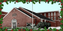 a red brick building with a cross on top of it