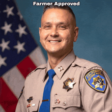 a man in a california highway patrol uniform is smiling in front of an american flag