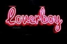 a red neon sign that says loverboy on a black background .