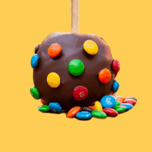 a chocolate apple with m and m 's on it