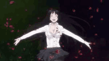 a woman in a white shirt with her arms outstretched is surrounded by red flowers .