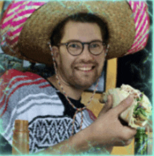 a man wearing a sombrero and glasses is holding a tortilla