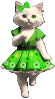 a white cat wearing a green dress with flowers and a bow