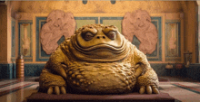 a statue of a toad in a room