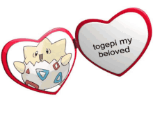 a heart shaped mirror with a picture of a pokemon and the words togepi my beloved