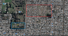 an aerial view of a cemetery with a red rectangle in the middle and a blue area in the middle