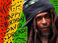 a man with dreadlocks wearing a hat that says " happy birthday david dread "