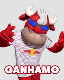 a bull mascot wearing sunglasses and a shirt that says ganhamo on it