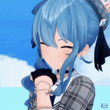 a girl with blue hair is wearing a plaid shirt and a bracelet with a star on it