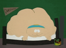 a cartoon character from south park is laying in a bed with a can of muscle milk .