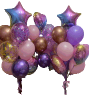 a bunch of pink and purple balloons with a star shaped balloon in the middle