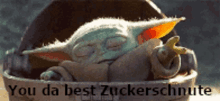 a baby yoda sleeping in a bucket with the words you da best zuckerschnute