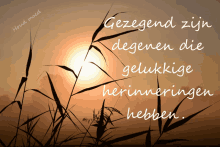 a sunset with the words gezegend zijn degenen die gelukkig herinneringen hebben