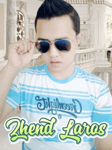 a man wearing sunglasses and a shirt that says ' shend laras '