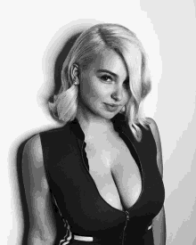 a black and white photo of a woman 's cleavage