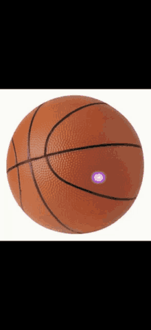 a basketball with a purple light on the center