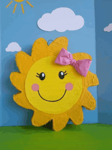 a sun with a pink bow on it 's head