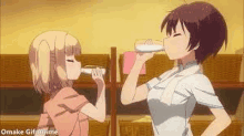 two anime girls are drinking from bottles in a bathroom .