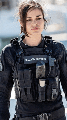 a woman wearing a vest that says lapd