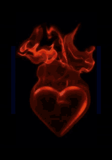 a red heart with flames coming out of it is on a black background