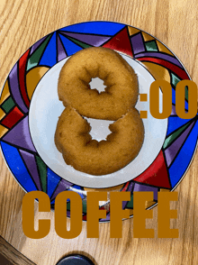 a plate with a donut and the word coffee