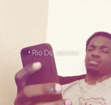 a man is taking a picture of himself with the words rio de janeiro on the bottom