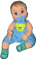 a baby doll with a pacifier in its mouth