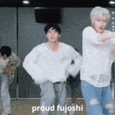 a group of young men are dancing in a room with the words " proud fujoshi " on the bottom