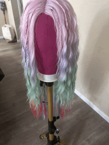 a mannequin with a pink wig on it