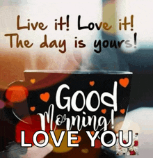 a picture of a cup of coffee with the words " live it love it the day is yours "