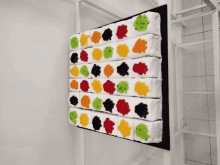 a display of white squares with different colored circles on them