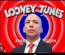 a man in front of a looney tunes logo