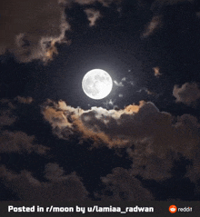 a full moon in a cloudy night sky is posted in r / moon by u / lamia_radwan