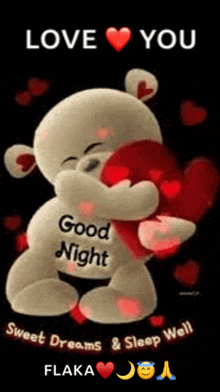 a teddy bear is hugging a heart with the words `` love you good night '' written on it .