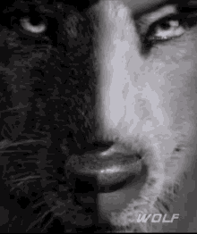 a black and white photo of a woman 's face with half a leopard and half a wolf