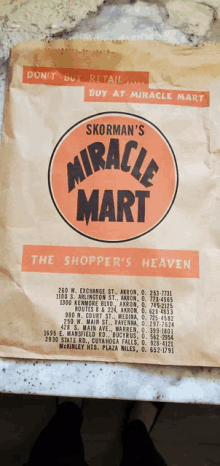 a brown paper bag that says skorman 's miracle mart the shopper 's heaven