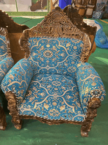 a chair with a blue and gold floral pattern