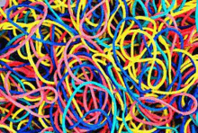 a bunch of colorful rubber bands are laying on the ground