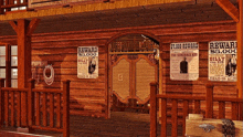 a reward poster for billy the kid hangs on a wooden wall