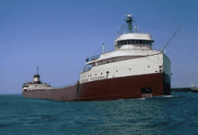 a large brown and white ship with the word federal on the front