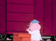 a cartoon pig is standing in front of a train car playing a piano .