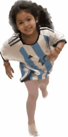 a young girl wearing a blue and white striped adidas shirt