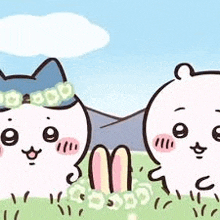 two cartoon cats and a teddy bear are standing next to each other in the grass .