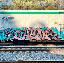 graffiti on a train car that says link on it