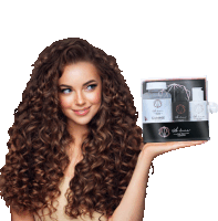 a woman with curly hair is holding a box of gummie hair products