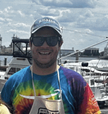 a man wearing a hat that says amazon is smiling