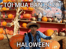 a man in a straw hat stands in front of a display of pumpkins with the words halloween written on the bottom