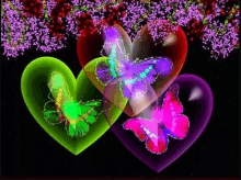 three colorful hearts with butterflies on them are surrounded by flowers on a black background .